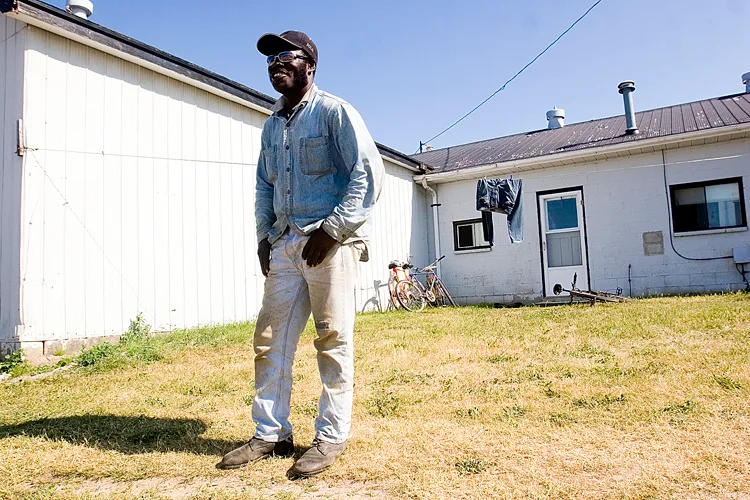 Shirley Wright outside his Canadian home at the Strawberry Place.